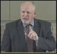 A person in a suit pointing his finger

AI-generated content may be incorrect.